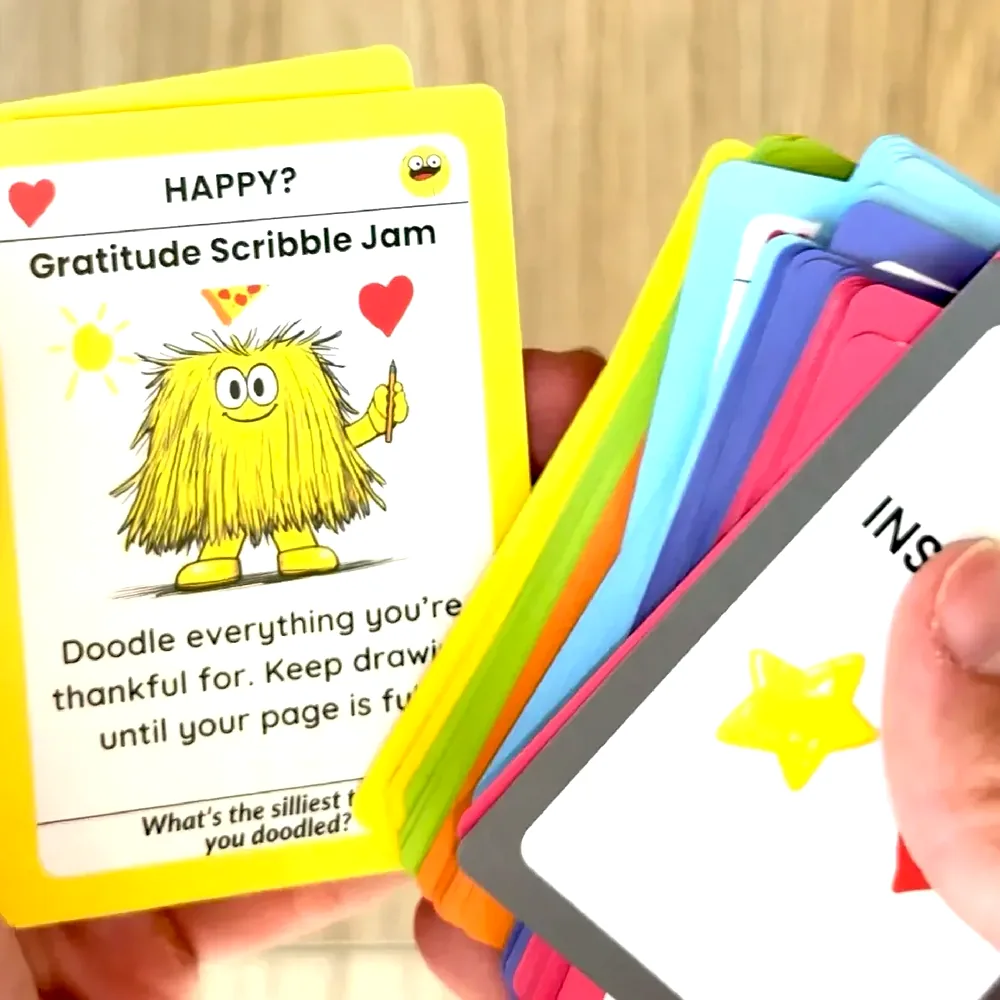 A parent fanning the Big Feelings cards in one hand